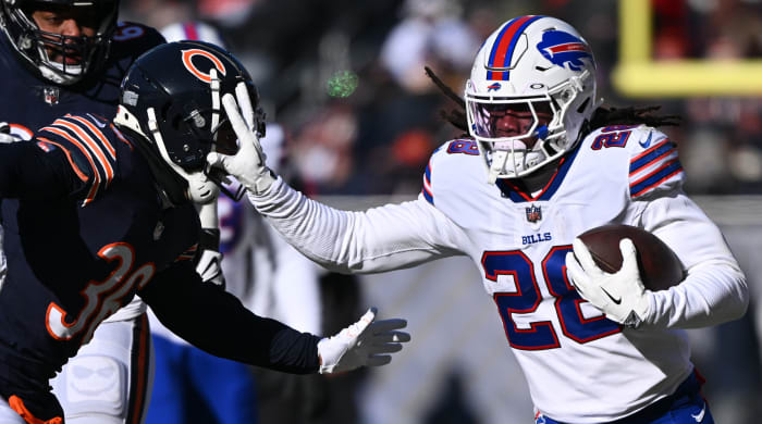 Buffalo Bills running back James Cook stiff arms Chicago Bears defensive back DeAndre Houston-Carson